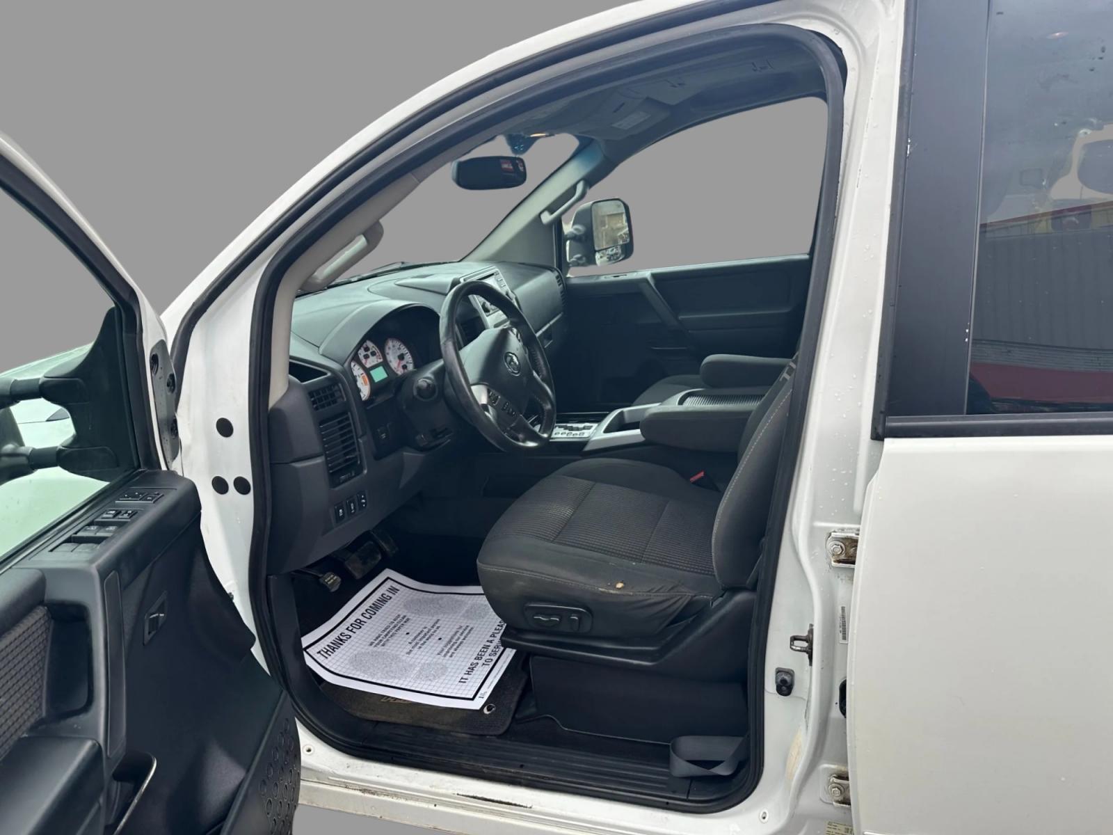 2013 White /Black Nissan Titan Pro-4X (1N6AA0EC0DN) with an 5.6L DOHC 32V V8 engine, Automatic transmission, located at 547 E. Main St., Orwell, OH, 44076, (440) 437-5893, 41.535435, -80.847855 - This 2013 Nissan Titan Pro-4X Crew Cab is a capable and well-equipped full-size pickup truck. It features a powerful 5.6L Endurance V8 engine paired with a 5-speed automatic transmission, a locking rear differential for improved traction, and a maximum towing capacity of 9,300 pounds. The truck is l - Photo #12